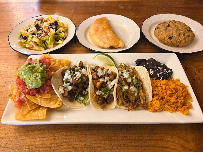 image of tacos and sides on plates